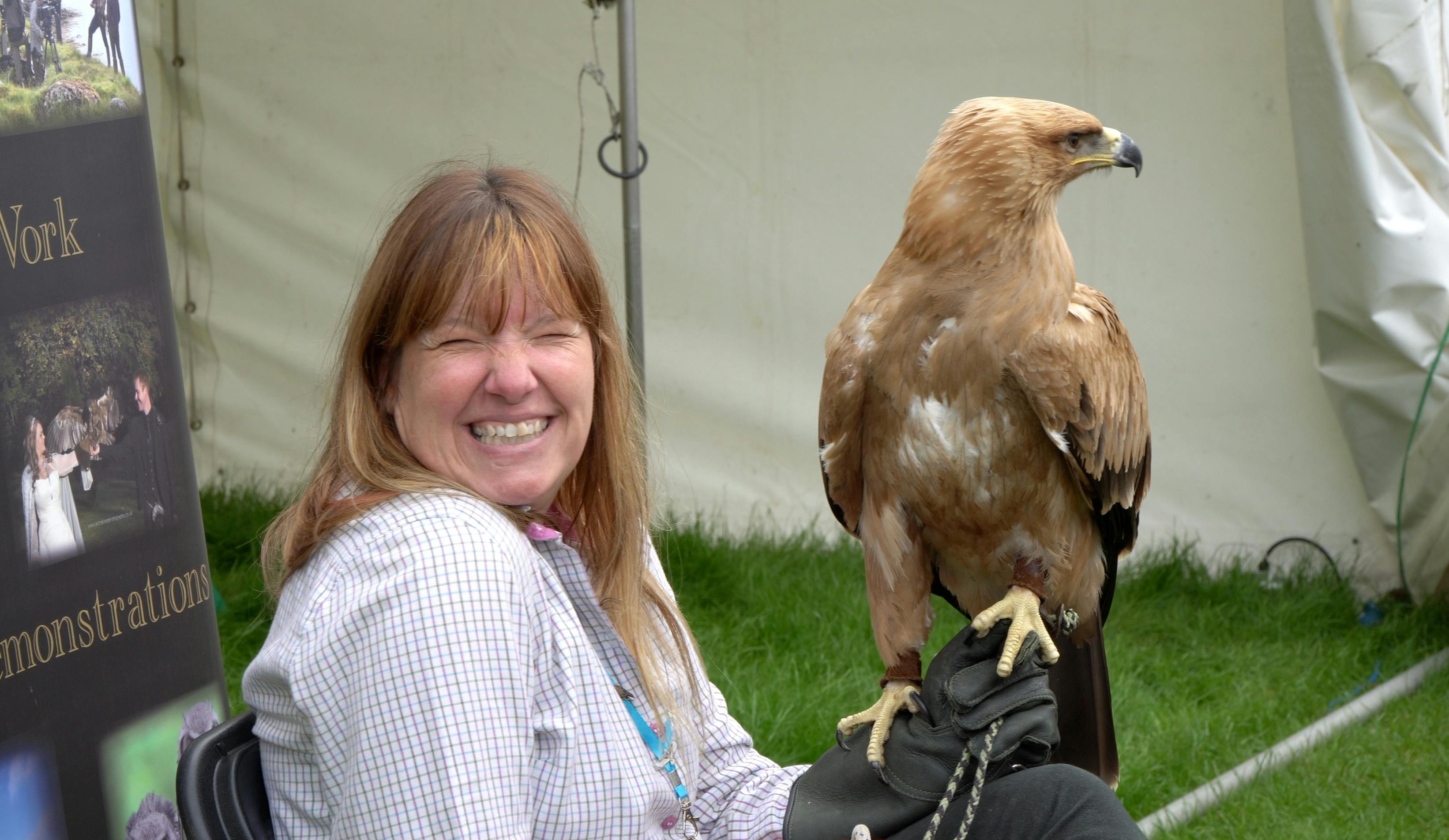 Women with bird of prey demonstrations by Elite Falconry at Royal Highland Show