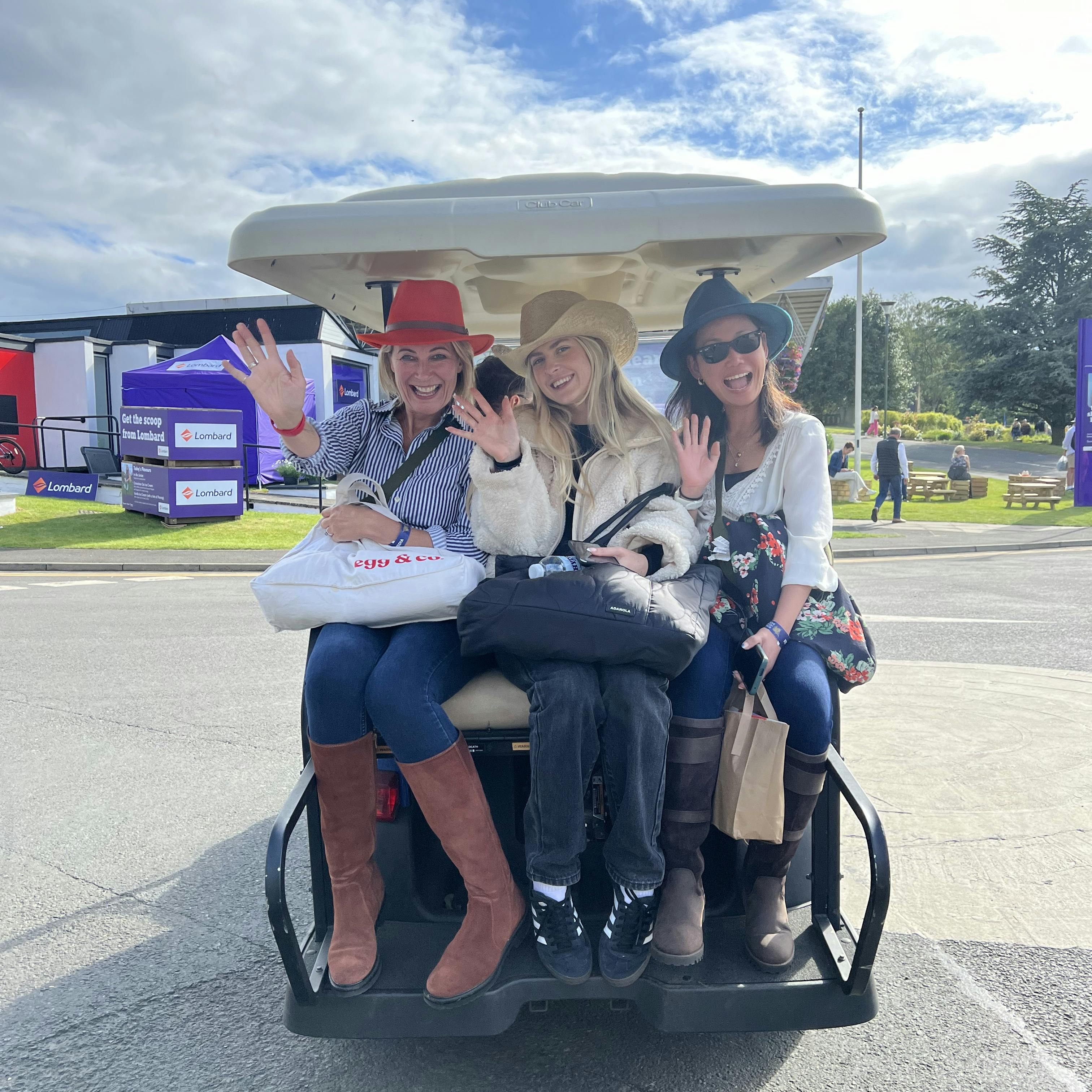 Team egg having fun on a golf caddy at The Royal Highland Show